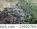 A small town village at top of hill.  23692760