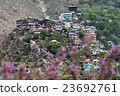 A small town village at top of hill.  23692761