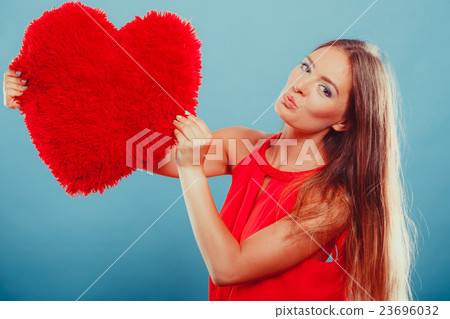 Woman with heart shape pillow. Valentines day love Woman with heart shape pillow. Valentines day love 23696032