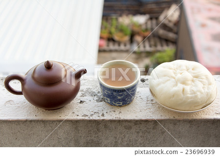 Chinese teapot Chinese tea and dumplings streamed. Chinese teapot Chinese tea and dumplings streamed. 23696939