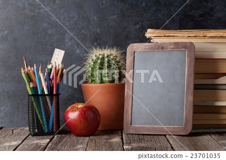 Books, cactus and chalk board Books, cactus and chalk board 23701035