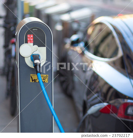 Electric Car in Charging Station. 23702217