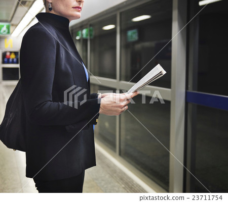 Businesswoman Lifestyle Commuter Newspeper Concept Businesswoman Lifestyle Commuter Newspeper Concept 23711754