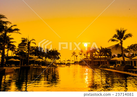 Beautiful Silhouette palm tree with umbrella and chair Beautiful Silhouette palm tree with umbrella and chair 23714081
