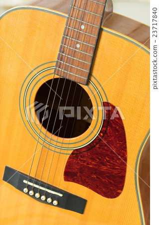 Close up on a classic guitar made of wood Close up on a classic guitar made of wood 23717840