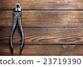 old rusty pliers on wooden background 23719390