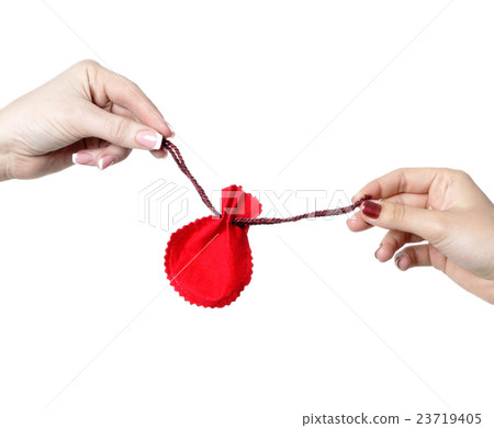 two woman hands hold gift bag isolated 23719405