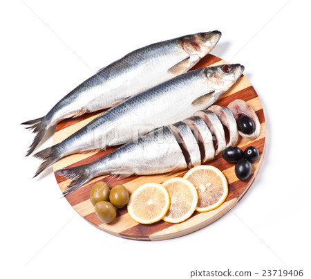 sliced herring on wooden plate 23719406