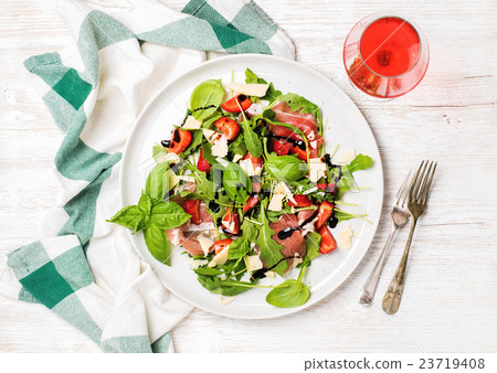 Summer arugula, prosciutto, strawberry salad with Summer arugula, prosciutto, strawberry salad with 23719408