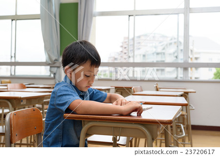 Elementary school boys taking notes seriously 23720617