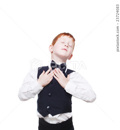 Redhead boy in vest with bow tie, happy and 23724083