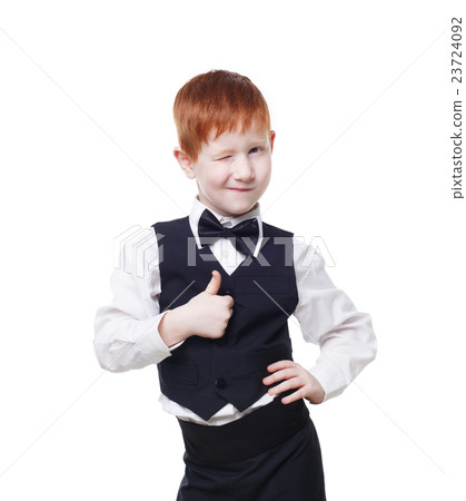 Redhead boy in vest wink and shows thumb up Redhead boy in vest wink and shows thumb up 23724092
