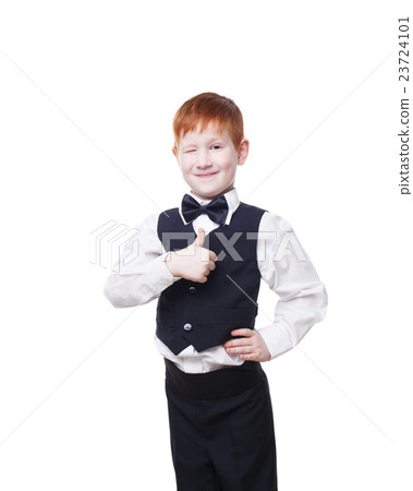 Redhead boy in vest wink and shows thumb up 23724101
