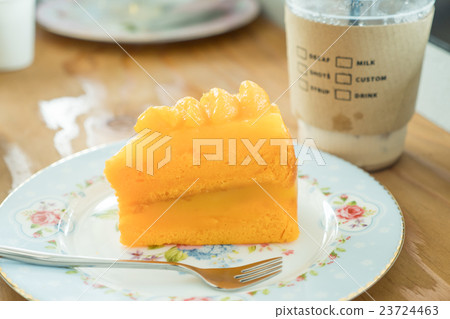 Orange cake and cold coffee 23724463