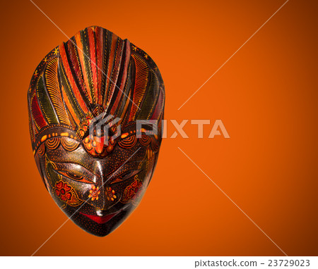 Traditional Indonesian mask in Bali stile on red Traditional Indonesian mask in Bali stile on red 23729023