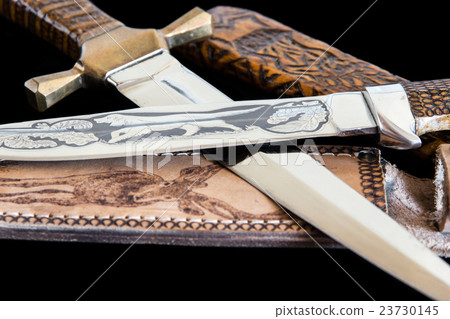 Cold weapon on black background 23730145
