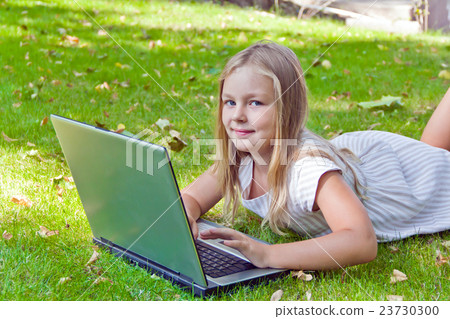Cute girl with laptop 23730300
