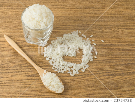 Uncooked Japanese Rice in A Wooden Spoon 23734728