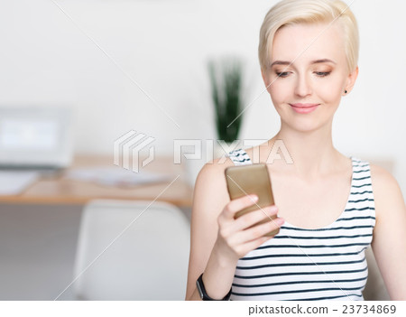 Woman looking at the phone 23734869
