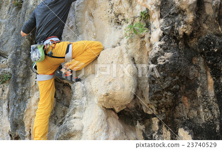 rock climber climbing on the rock 23740529