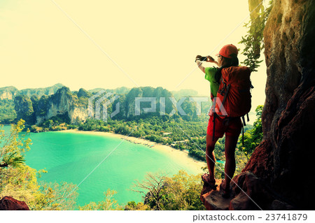 woman hiker taking photo with smartphone  23741879