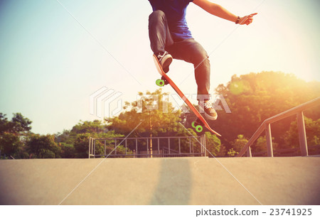 young skateboarder skateboarding at skatepark young skateboarder skateboarding at skatepark 23741925