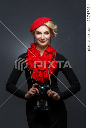 Beautiful lady with retro photo camera 23747014