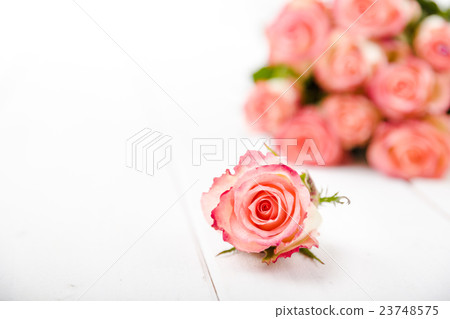 Fragrant flowers on wooden background 23748575
