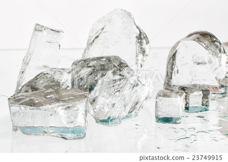 Ice cubes on the table 23749915