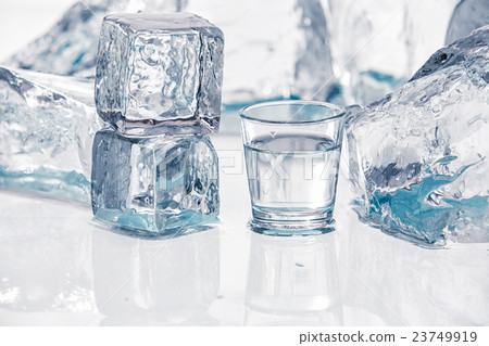 Ice cubes on the table 23749919