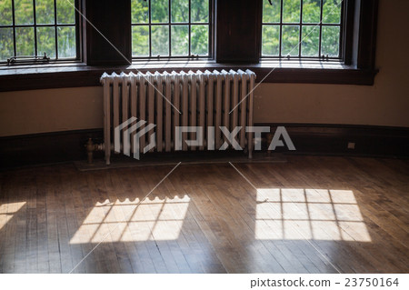 light from windows on an old wood floor 23750164