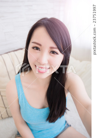 young woman is taking selfies 23751997