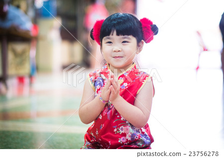 The Little Asian girl wishing you a happy Chinese new year 23756278