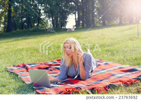 Portrait of young attractive girl working with 23763692