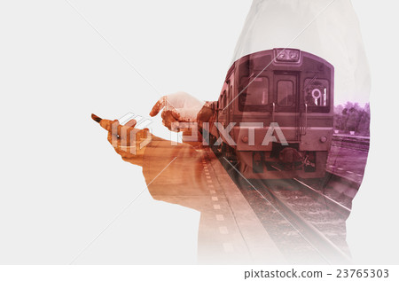 Business Man use Mobiel Phone with Train Stat 23765303