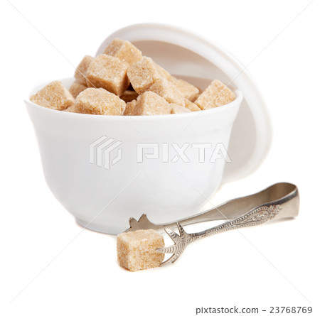 Brown sugar in a bowl 23768769