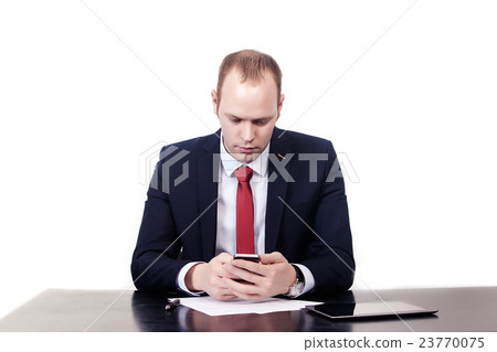 Serious European businessman in red tie at the Serious European businessman in red tie at the 23770075