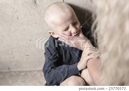 Neglected lonely child leaning at the wall 23770572