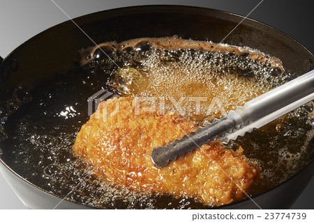 Pork cutlet (in cooking) 23774739