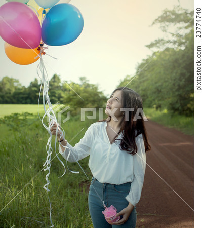 Asian,Girl alone holding balloon colorfull 23774740
