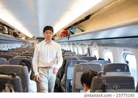 Men walking in the train in the bullet train 23775195