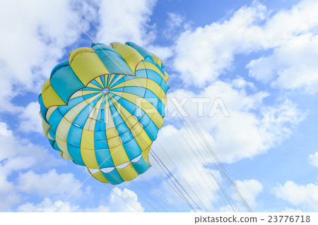 Parasailing, beach umbrella on sky background Parasailing, beach umbrella on sky background 23776718