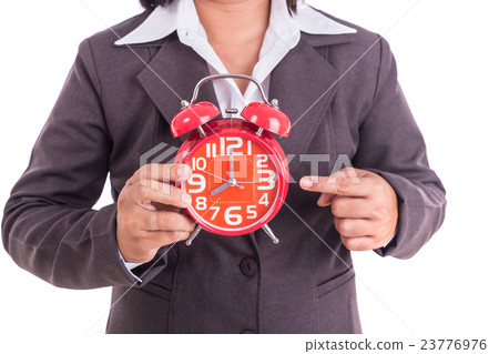 Woman holding red alarm clock isolated on white Woman holding red alarm clock isolated on white 23776976