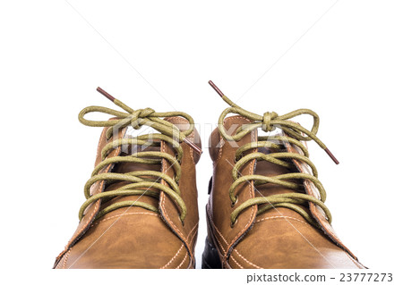 New brown leather shoe isolated on white background New brown leather shoe isolated on white background 23777273