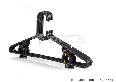 Close up pack of new black clothes hanger isolated on white . 23777333