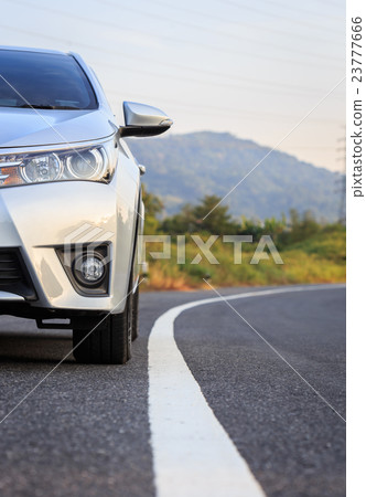 Front of new silver car parking on the asphalt road 23777666