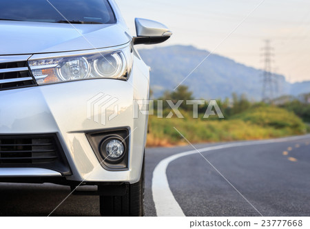Front of new silver car parking on the asphalt road Front of new silver car parking on the asphalt road 23777668