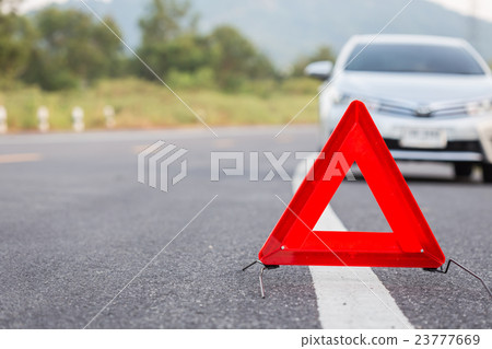 Red emergency stop sign and broken car on the road Red emergency stop sign and broken car on the road 23777669