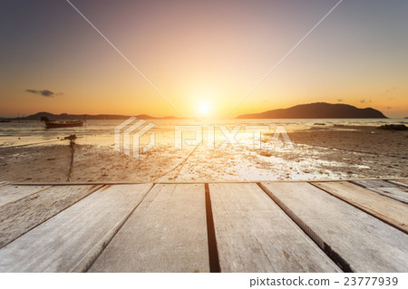 Empty top of wooden table and view of sunset or sunrise background 23777939