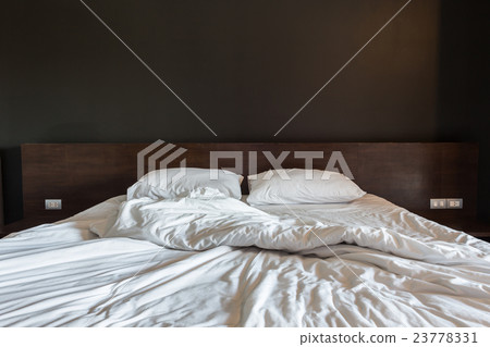 White bedding sheets and pillow, Messy bed concept White bedding sheets and pillow, Messy bed concept 23778331